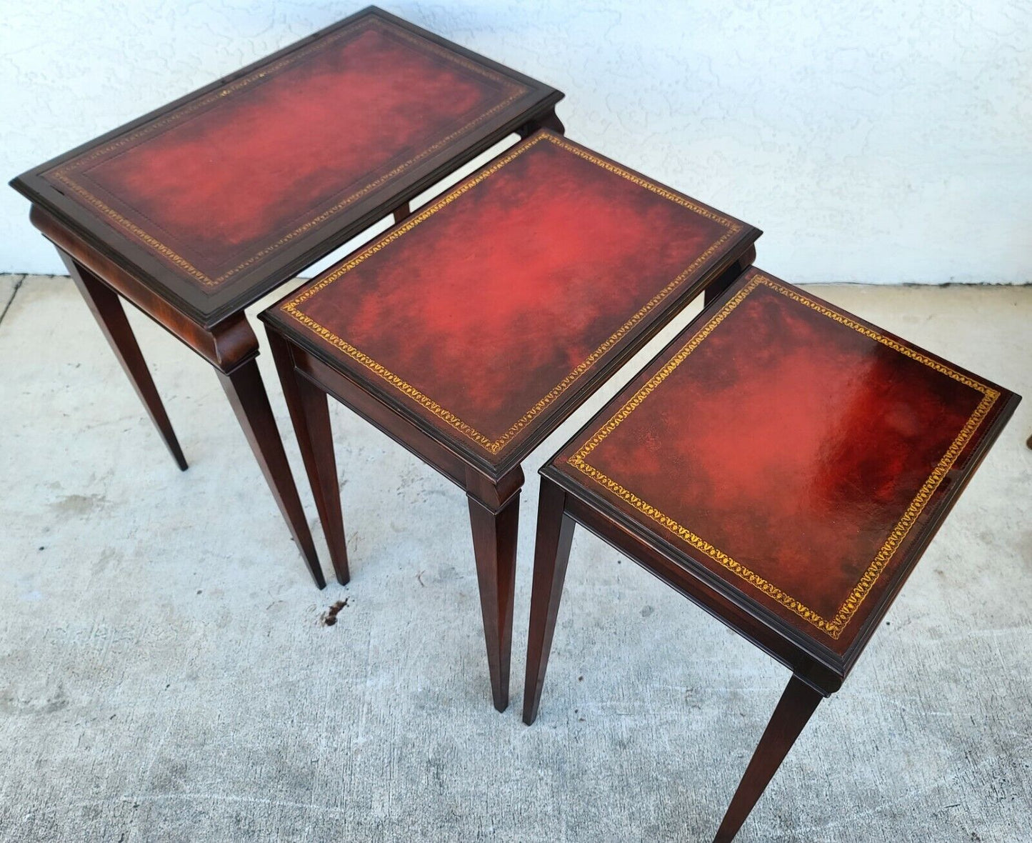 Mid Century Tooled Red Leather Mahogany Nesting Tables