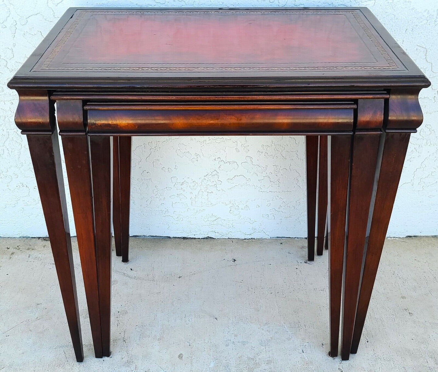 Mid Century Tooled Red Leather Mahogany Nesting Tables