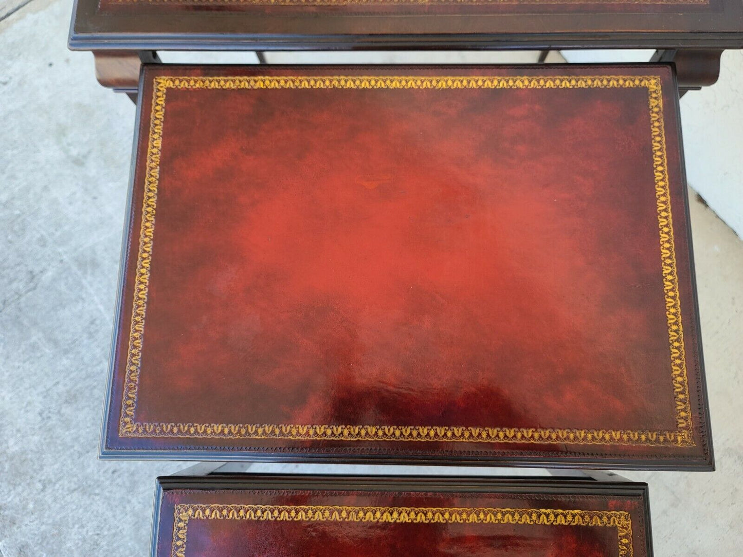 Mid Century Tooled Red Leather Mahogany Nesting Tables